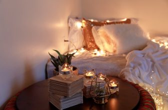 A warm and inviting living space featuring various home accessories like soft textiles, candles, and decorative items that enhance comfort and personality.