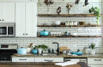 A collection of essential kitchen tools and accessories on a countertop, including utensils, storage containers, and cooking gadgets.